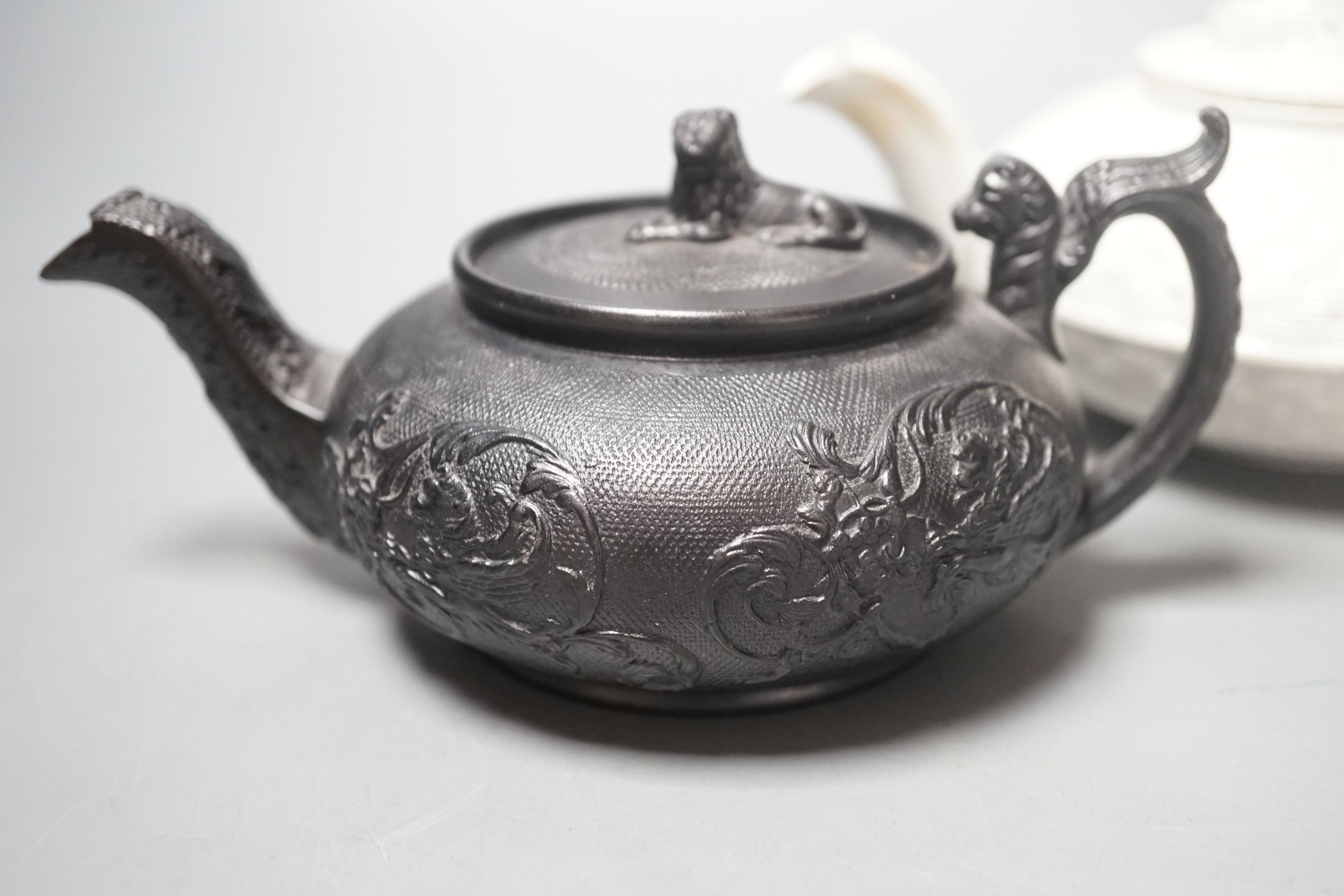 A Wedgwood caneware teapot c.1810 and an English black basalt teapot c.1810